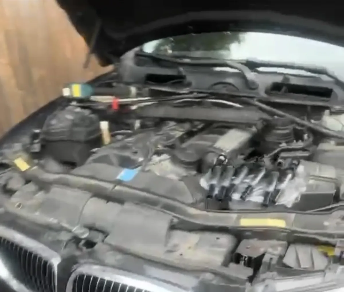 Vehicle engine compartment photographed during real work